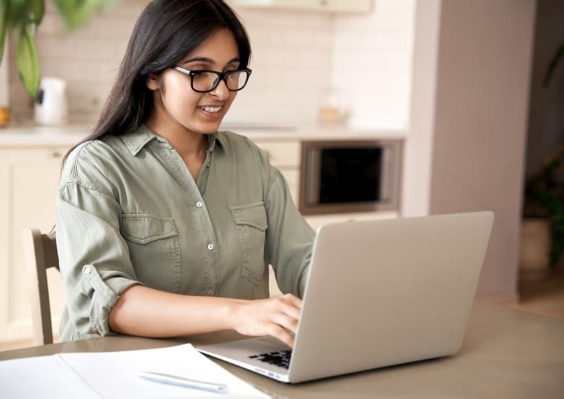 woman in glasses on a laptop